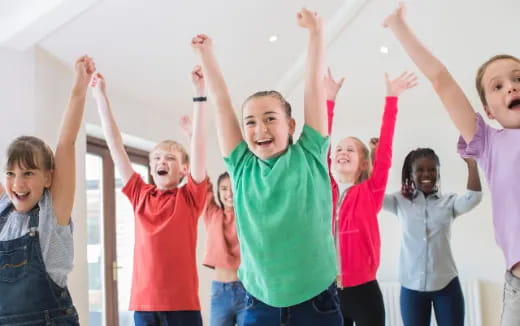 a group of people raising their hands