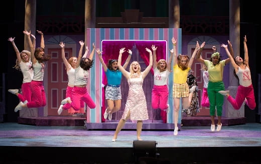 a group of women dancing on a stage