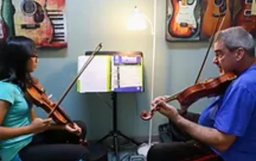 a man and a woman playing instruments