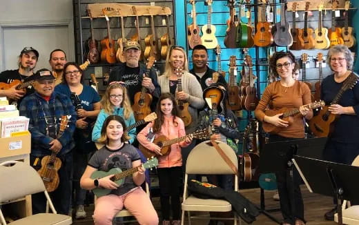 a group of people holding instruments
