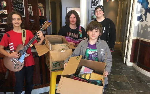 a group of people holding musical instruments