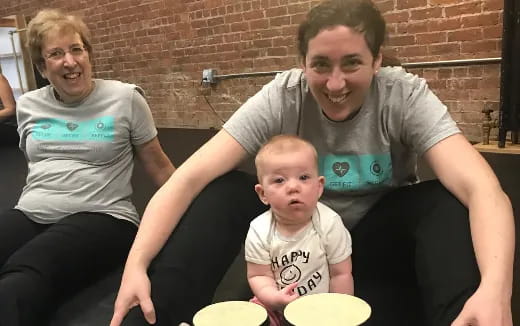a man and woman with a baby