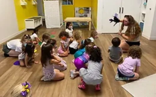 a group of children sitting on the floor