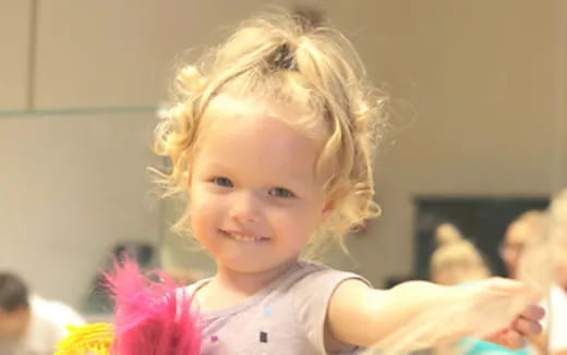 a little girl with blonde hair