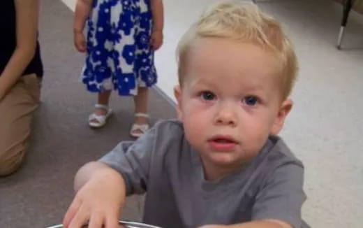 a child sitting on the floor