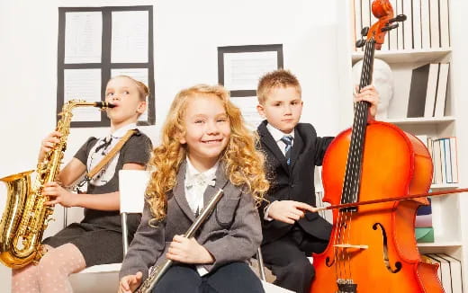 a group of kids playing instruments