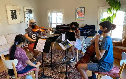 a group of people playing musical instruments