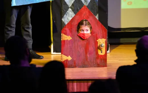 a person holding a red box