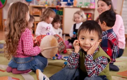 a group of children sitting in a circle