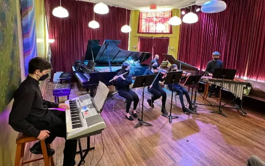 a group of people playing musical instruments