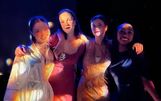 a group of women posing for a photo