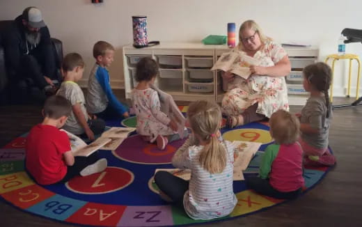 a group of children sitting on the floor