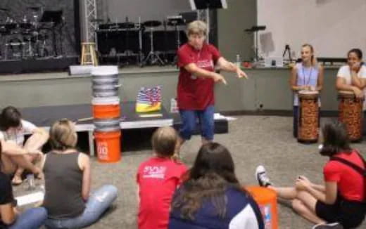 a person standing in front of a group of people