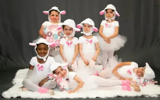 a group of children wearing white hats