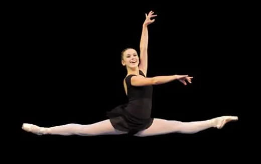 a woman dancing on a stage