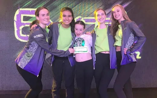a group of girls posing for a photo