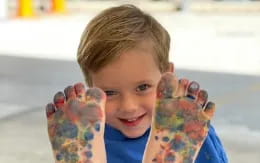 a boy holding a toy