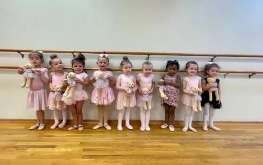 a group of girls in dresses