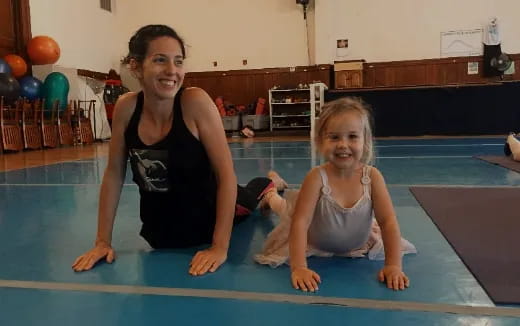 a person and a child in a swimming pool