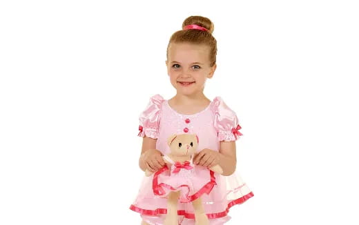 a girl holding a stuffed animal