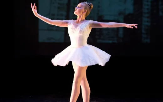 a woman dancing on a stage