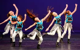 a group of women dancing on a stage