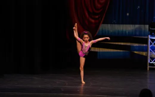 a woman dancing on a stage