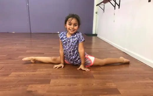 a girl sitting on the floor