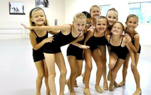 a group of girls posing for a picture