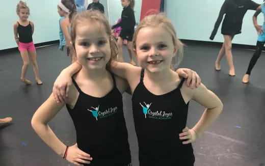 a couple of girls posing for the camera