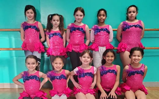a group of girls posing for a photo