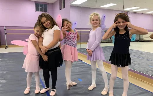 a group of girls posing for a photo