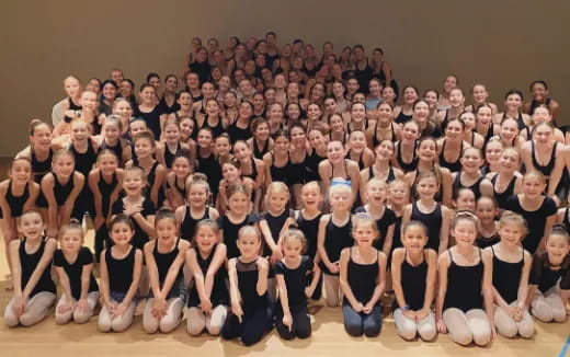 a large group of people posing for a photo