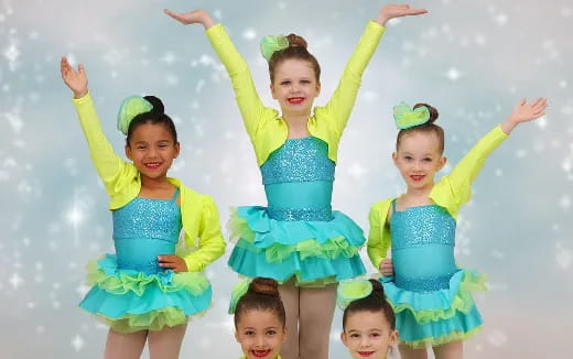 a group of children in dresses