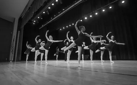 a group of women dancing on a stage