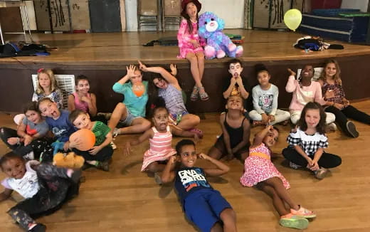 a group of children sitting on the floor