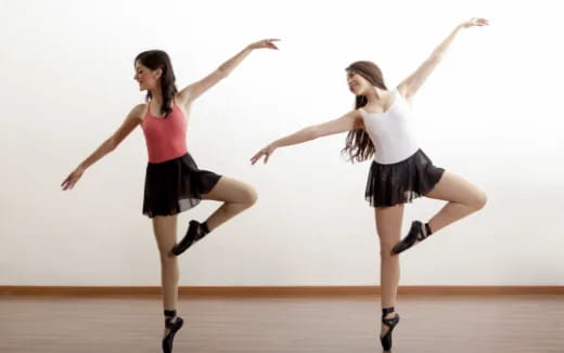 two women jumping in the air