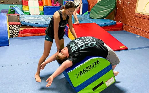 a man and woman on a mat