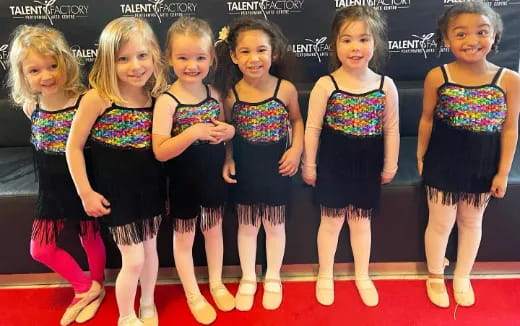 a group of girls posing for a photo