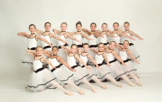 a group of people in white