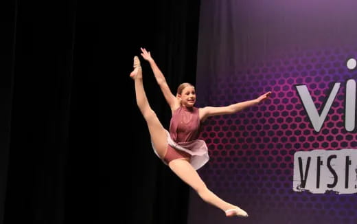 a woman dancing on a stage