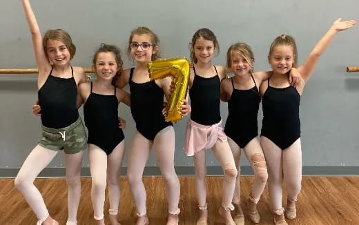 a group of girls posing for a photo