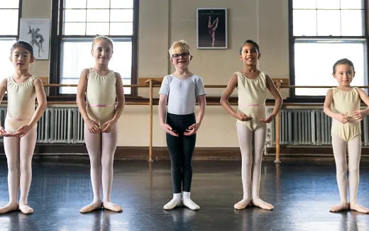 a group of women in white pants