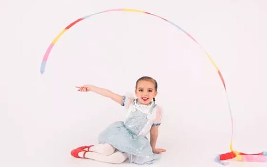 a baby sitting on the ground