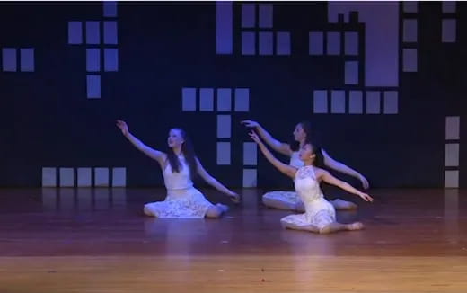 a group of women dancing on a stage