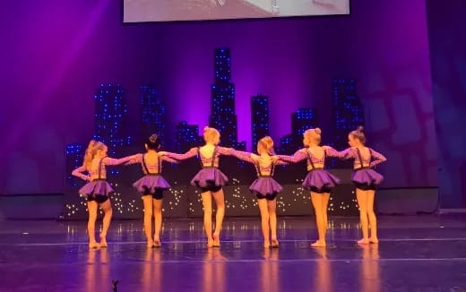 a group of women on a stage