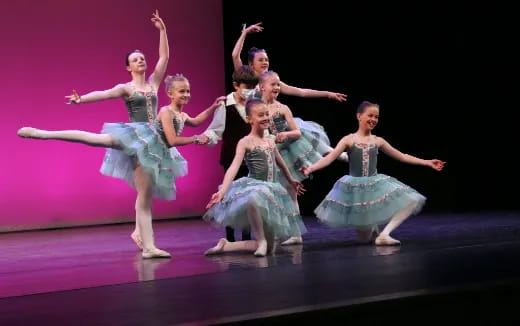 a group of women dancing on a stage