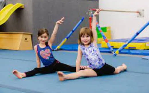 a couple of girls doing yoga