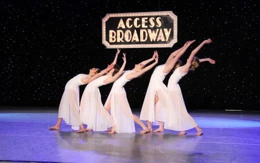 a group of women dancing on a stage