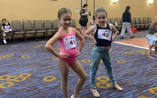 a couple of girls posing for a picture